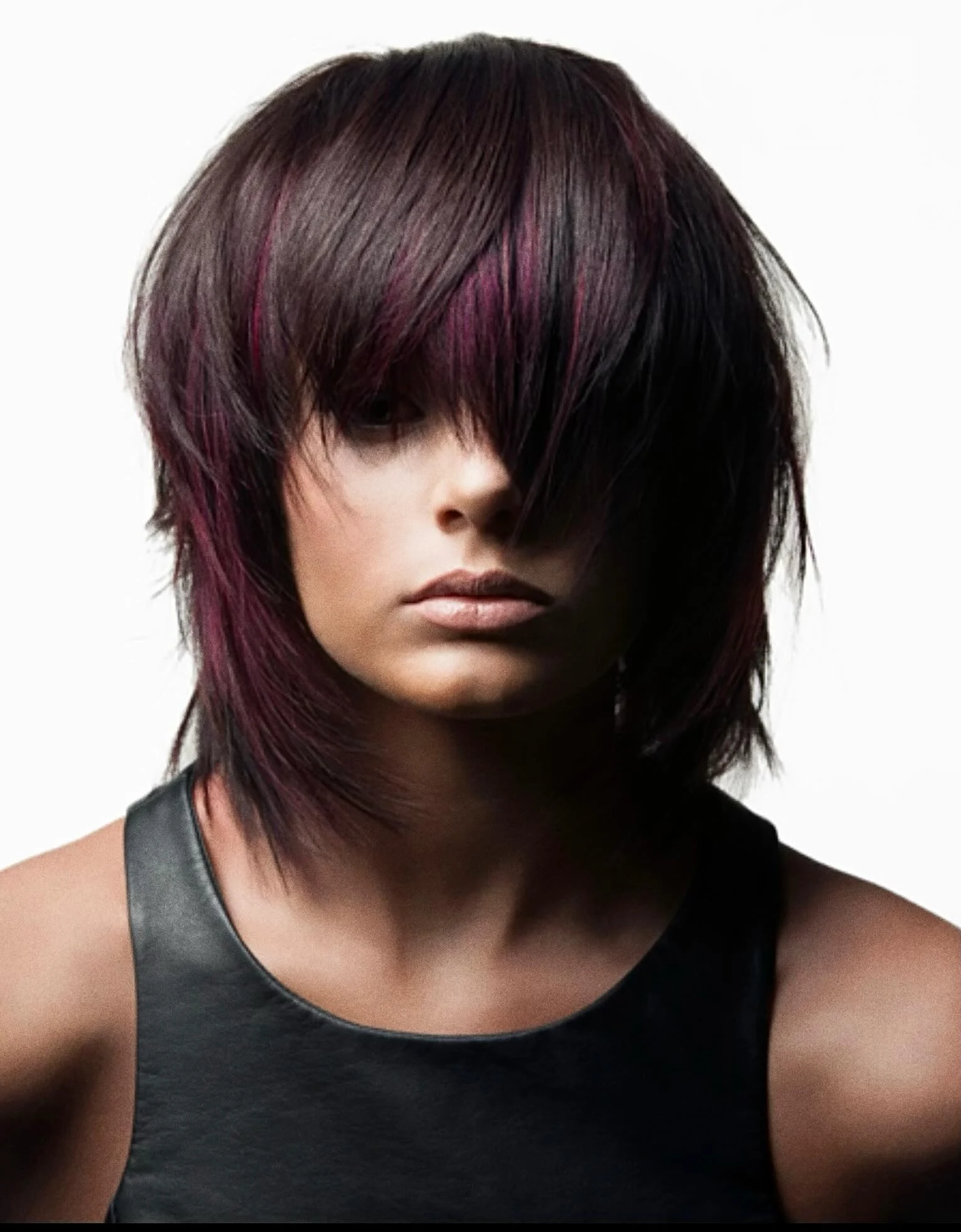 Woman with thin fine hair wearing an asymmetrical shaggy bob longer on one side