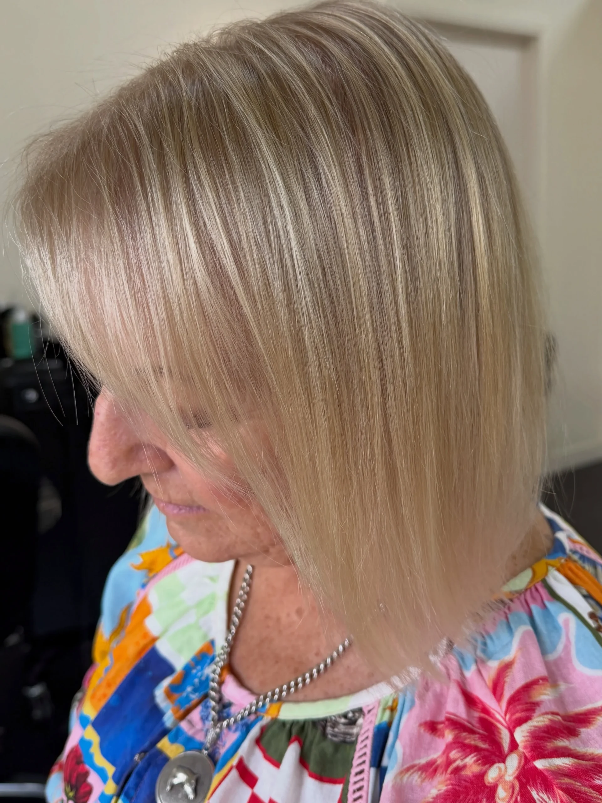 Woman over 60 with fine thinning hair styled in a bob for added fullness