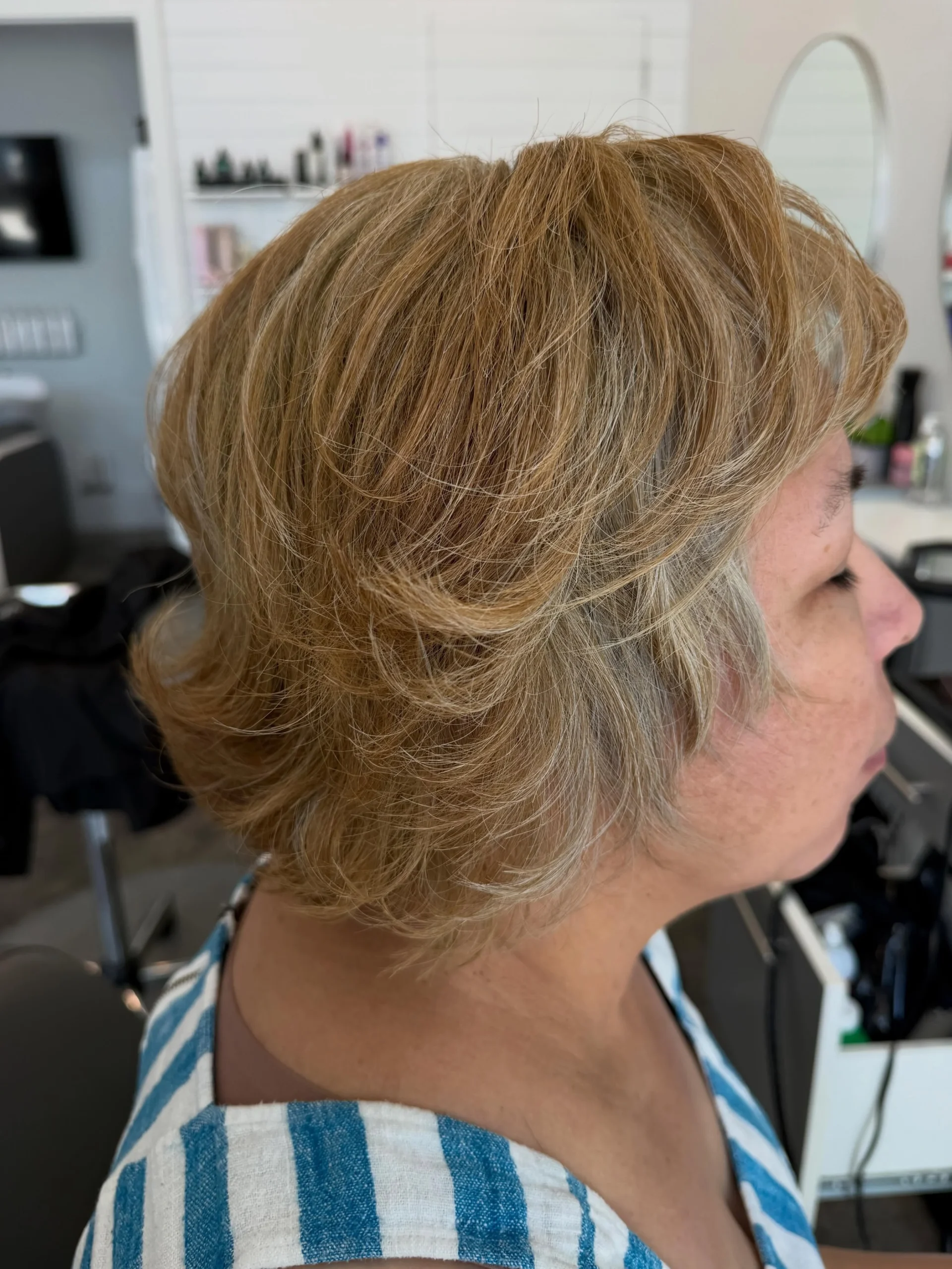 Woman over 60 with thick coarse hair styled in a bob
