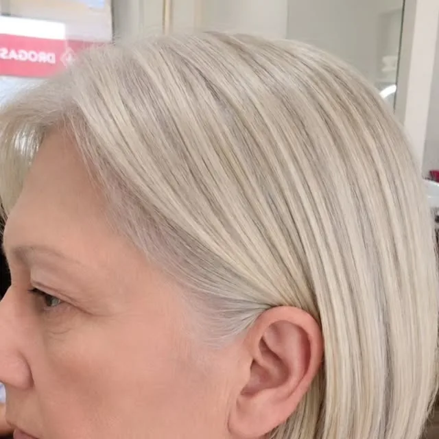 Woman over 50 with fine hair wearing a chin-length bob with soft layers