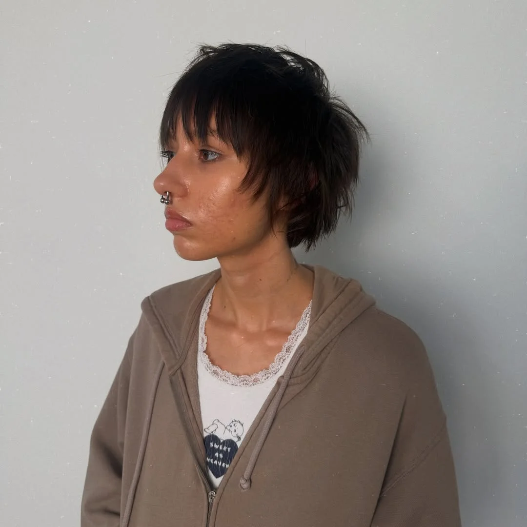Woman with an edgy grunge-inspired choppy pixie with messy, undone texture