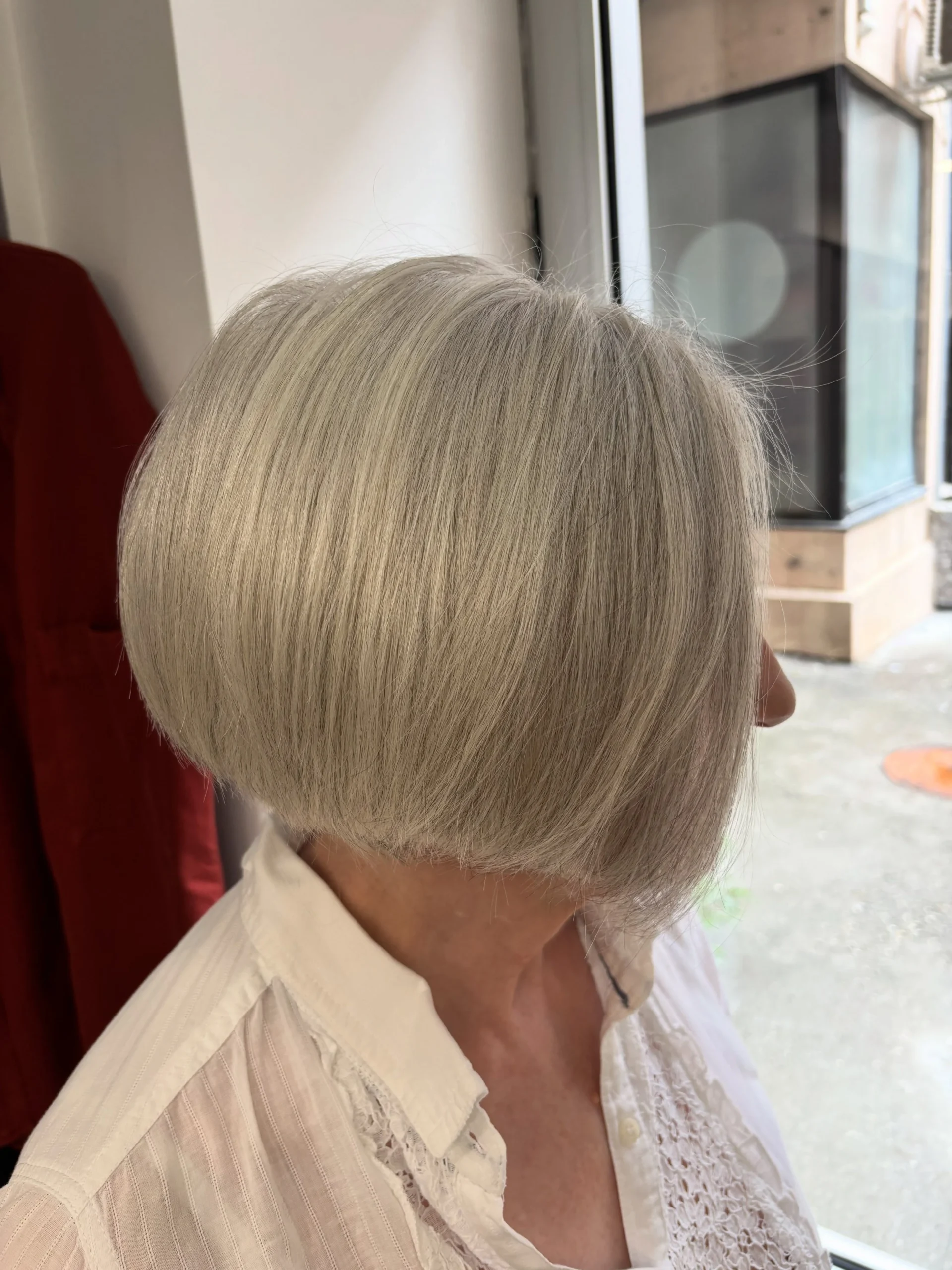 Woman over 60 with bob haircut cut to stay sharp between trims