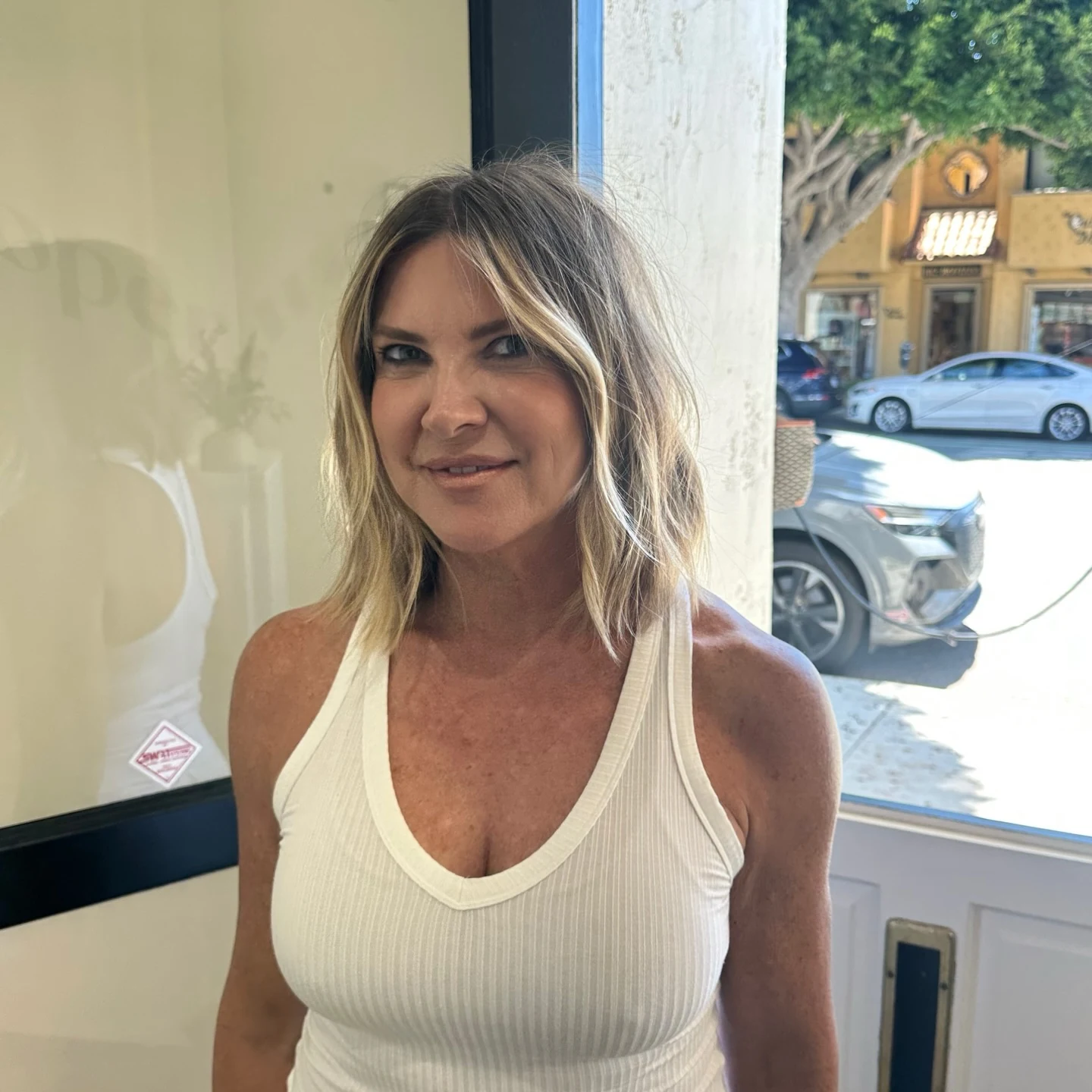 Woman with thin fine hair wearing a shaggy bob styled with gentle, soft loose waves