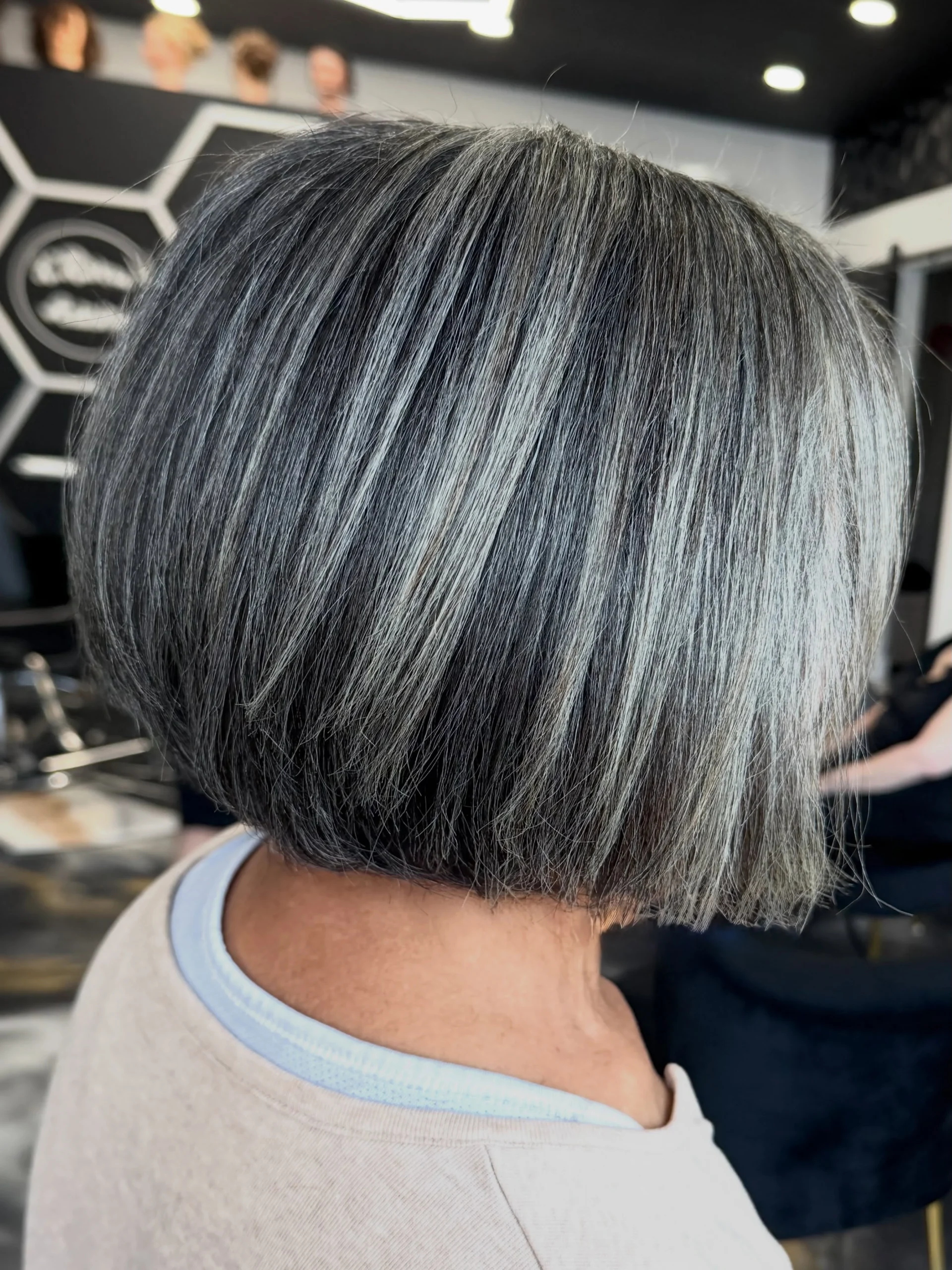 Woman over 60 with sleek straight bob styled for a polished look