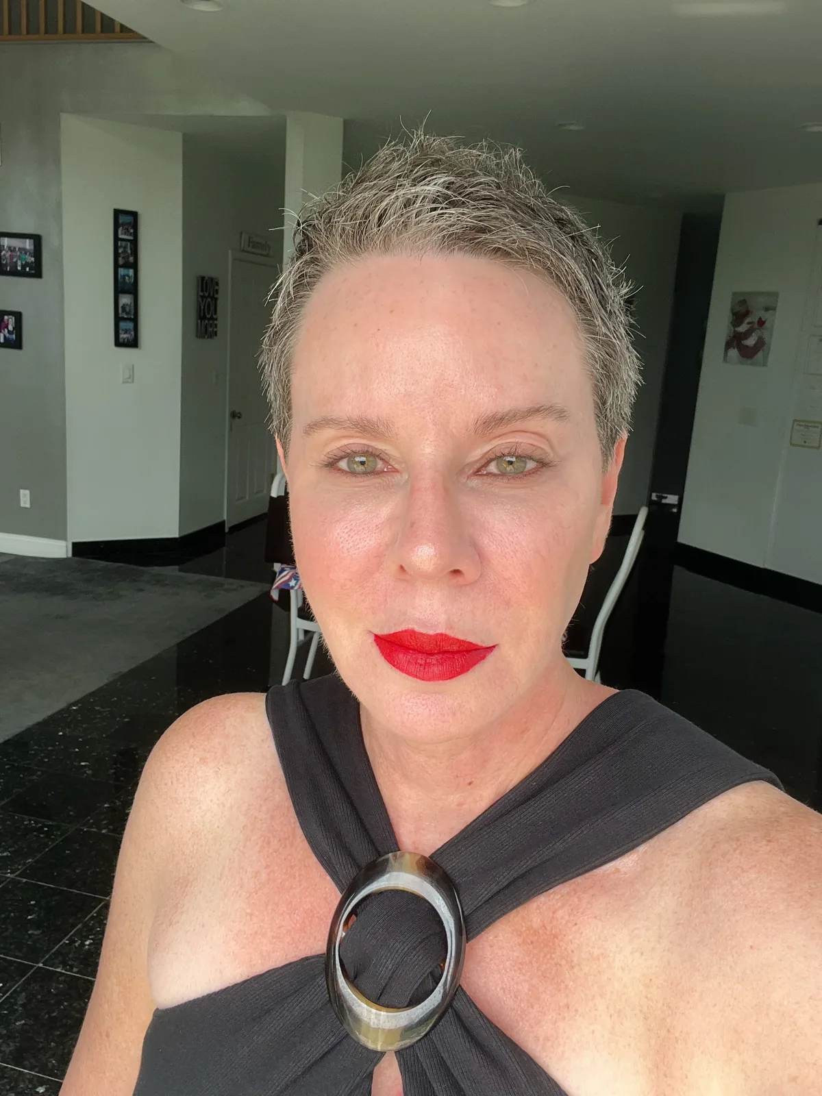 Woman over 50 with a silver-gray textured pixie crop with piece-y ends, shown from front, side, and back in a salon collage.