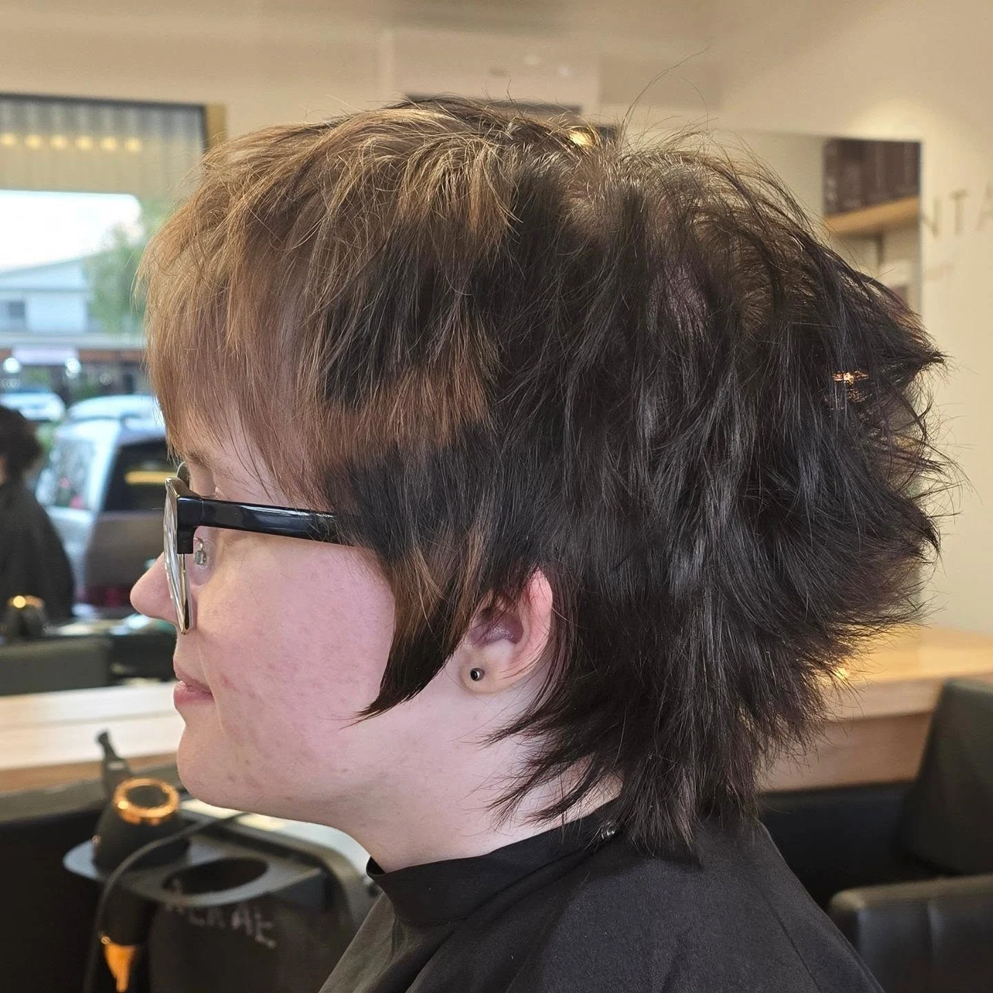 Woman with thin fine hair wearing a short textured crop shag bob