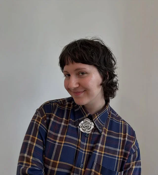 Woman with an edgy wolf-cut pixie featuring heavy layering and shaggy texture