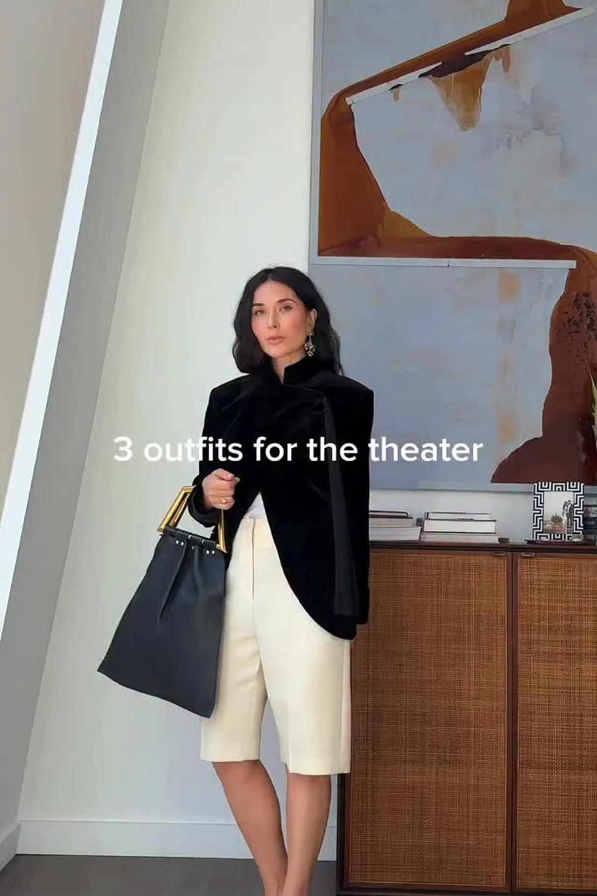 Woman over 50 in a black velvet blazer, one of the elegant gothic Halloween costumes