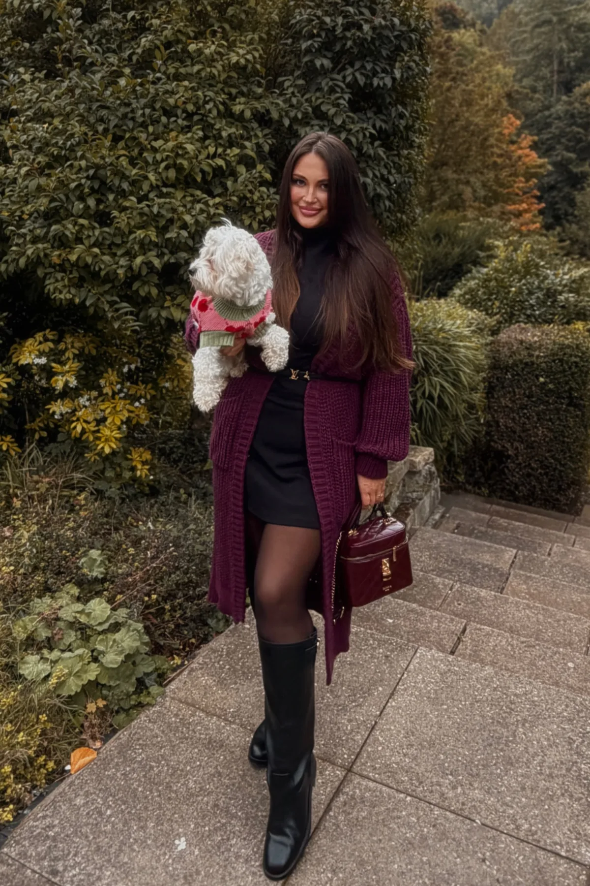 Woman in a burgundy cardigan and black jeans, casual gothic Halloween costumes for women